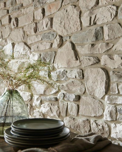 Dutch Quality Tuscan Ridge Winter Point white and gray thin stone with dining table in foreground